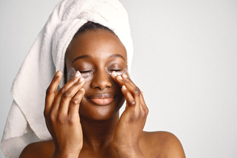 black-girl-with-towel-head-has-eye-patches-isolated-white-background