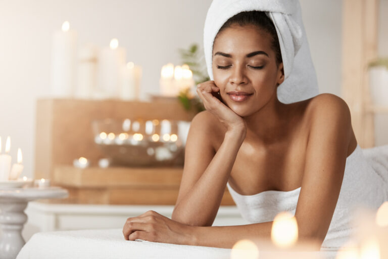 tender-african-woman-with-towel-head-resting-relaxing-spa-salon